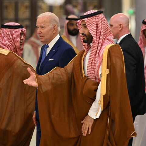 TOPSHOT - US President Joe Biden (C-L) and Saudi Crown Prince Mohammed bin Salman (C) arrive for the family photo during the Jeddah Security and Development Summit (GCC+3) at a hotel in Saudi Arabia's Red Sea coastal city of Jeddah on July 16, 2022. (Photo by MANDEL NGAN / POOL / AFP) (Photo by MANDEL NGAN/POOL/AFP via Getty Images)